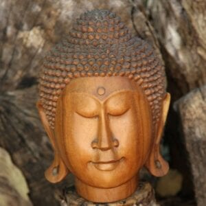 Carved wood Buddha head